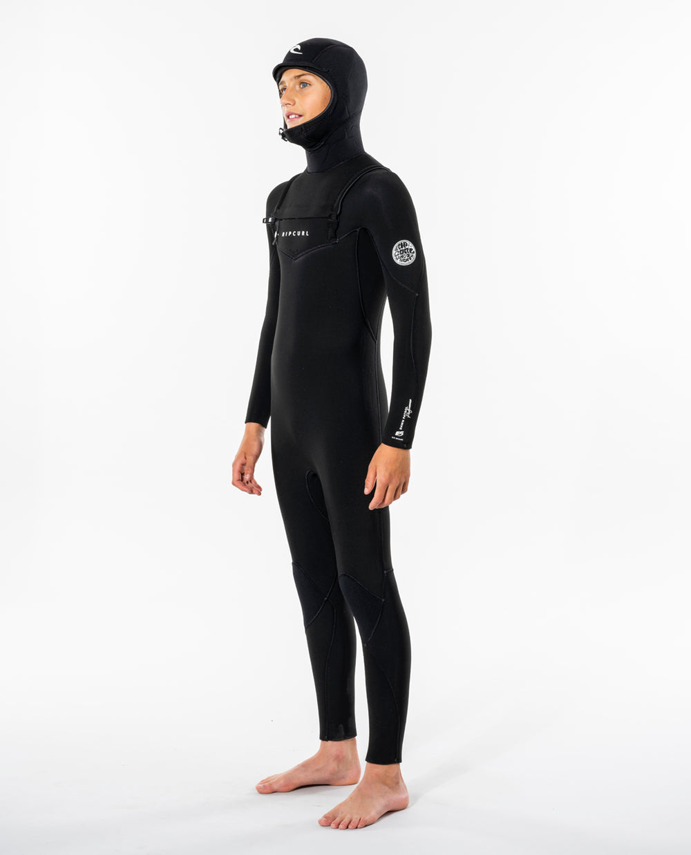 Side view of model wearing black Rip Curl Dawn Patrol kids hooded wetsuit