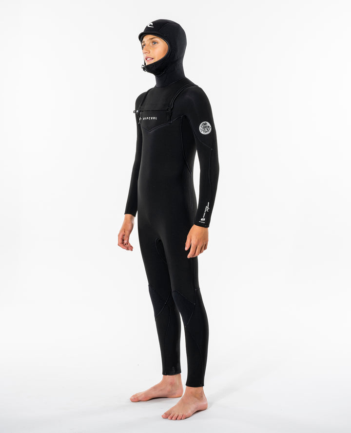Side view of model wearing black Rip Curl Dawn Patrol kids hooded wetsuit